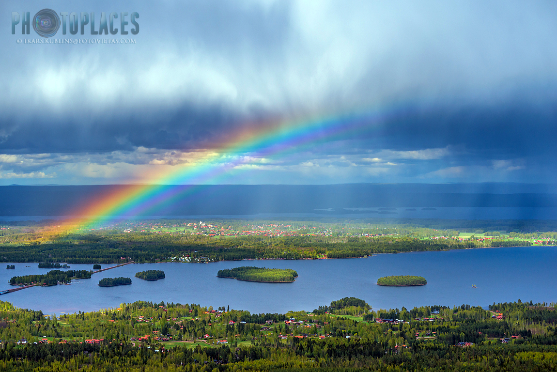 Siljan lake and Solleron island with rainbow and rain cloud